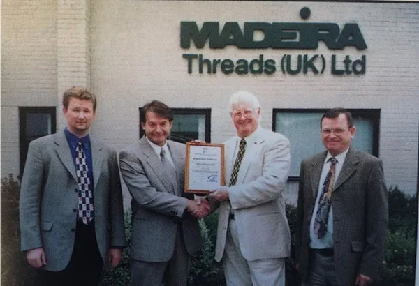 Photo of the collaboration in 1992 between the Schmidt Brothers of Madeira Threads and the Macpherson family.