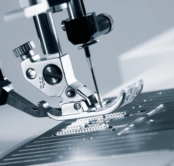 side view of bernina B 540 sewing machine in silver and white with digital display.
