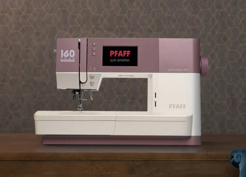 Front view of a Pfaff quilt ambition 160 year anniversary edition sewing machine on a white background. 