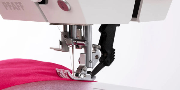 pfaff expression 710 activstitch sewing pink cloth with thread.