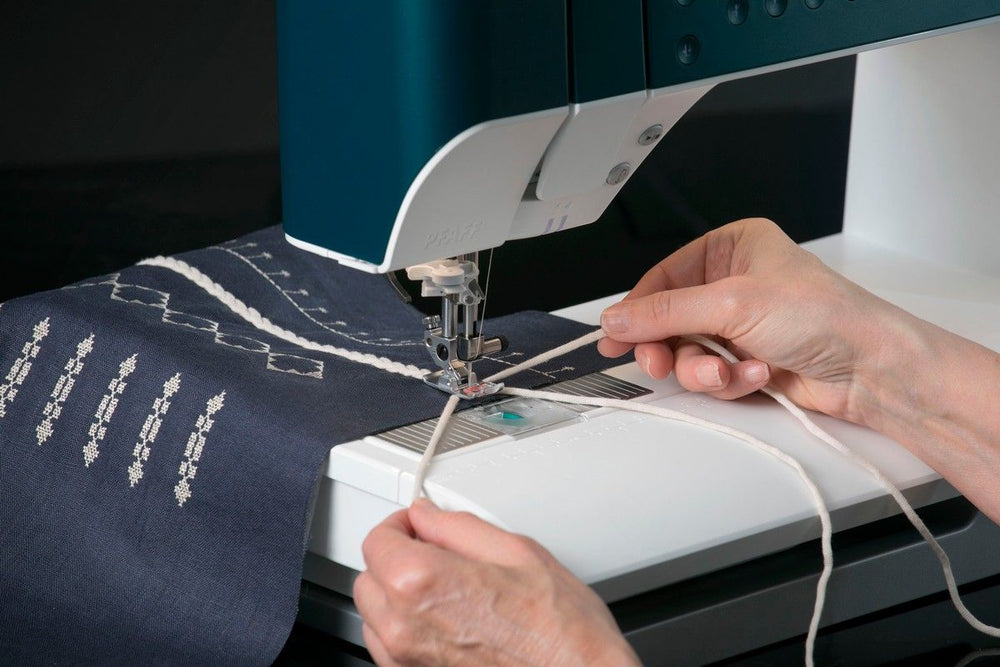 Front view of a Pfaff performance icon sewing machine on a white background.